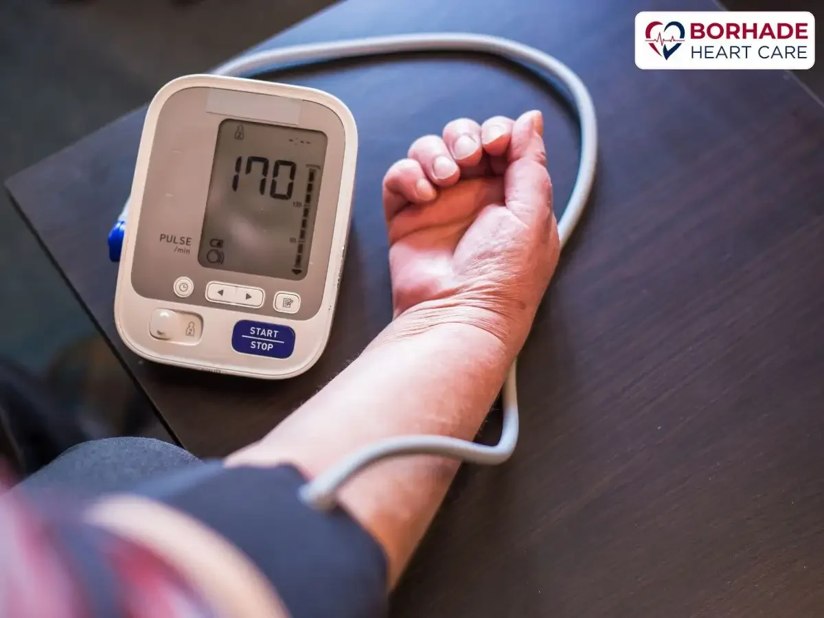 Portable BP machine connected to hand.