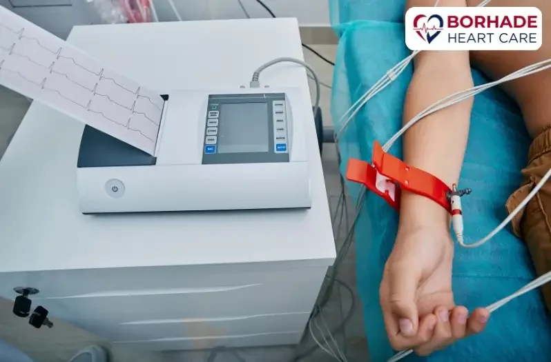 Live ECG Test being conducted with wires connected on hand.