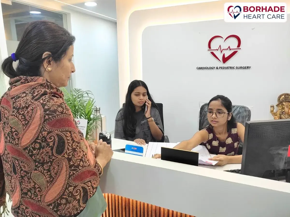 Reception team assisting patients and handling phone enquiries at Borhade Heart Care, Ravet