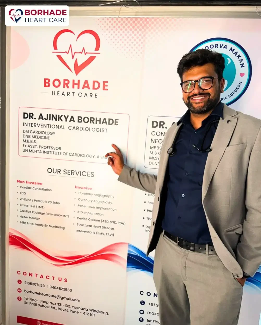 Dr. Ajinkya Borhade pointing his name on Signage poster at Clinic.
